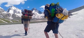 Walking over icefields Laspur Trek