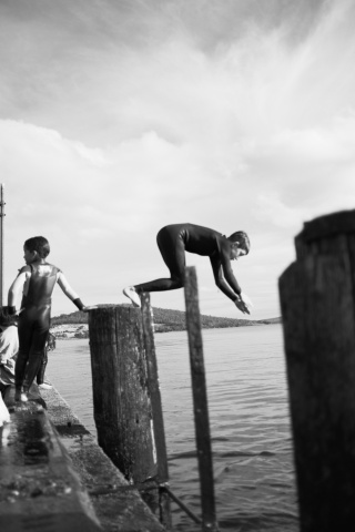Kids jumping into Bruny ocean