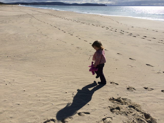 Child playing on the Neck Beach