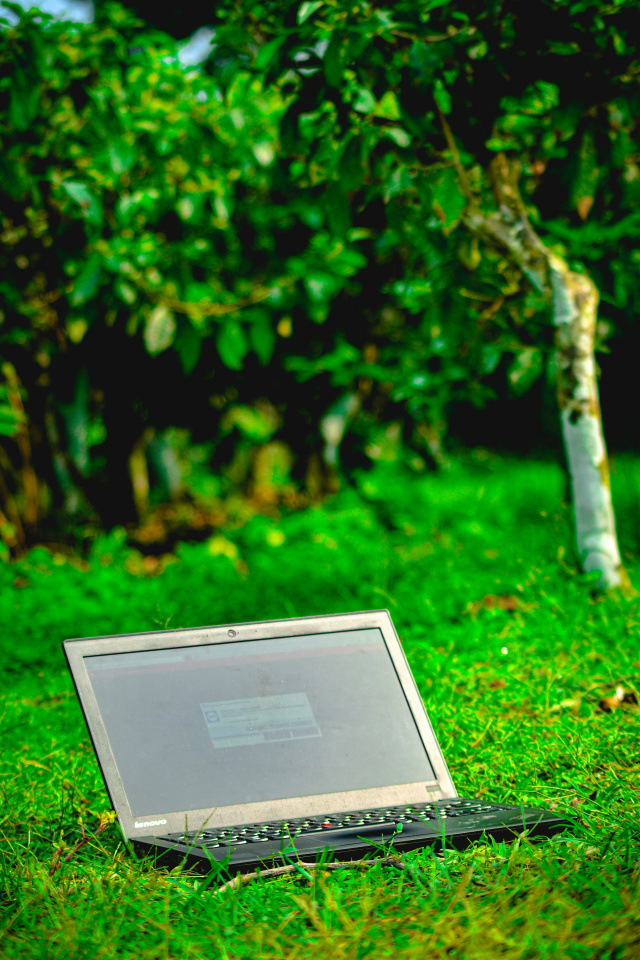 Imdadul hussain laptop on grass unsplash